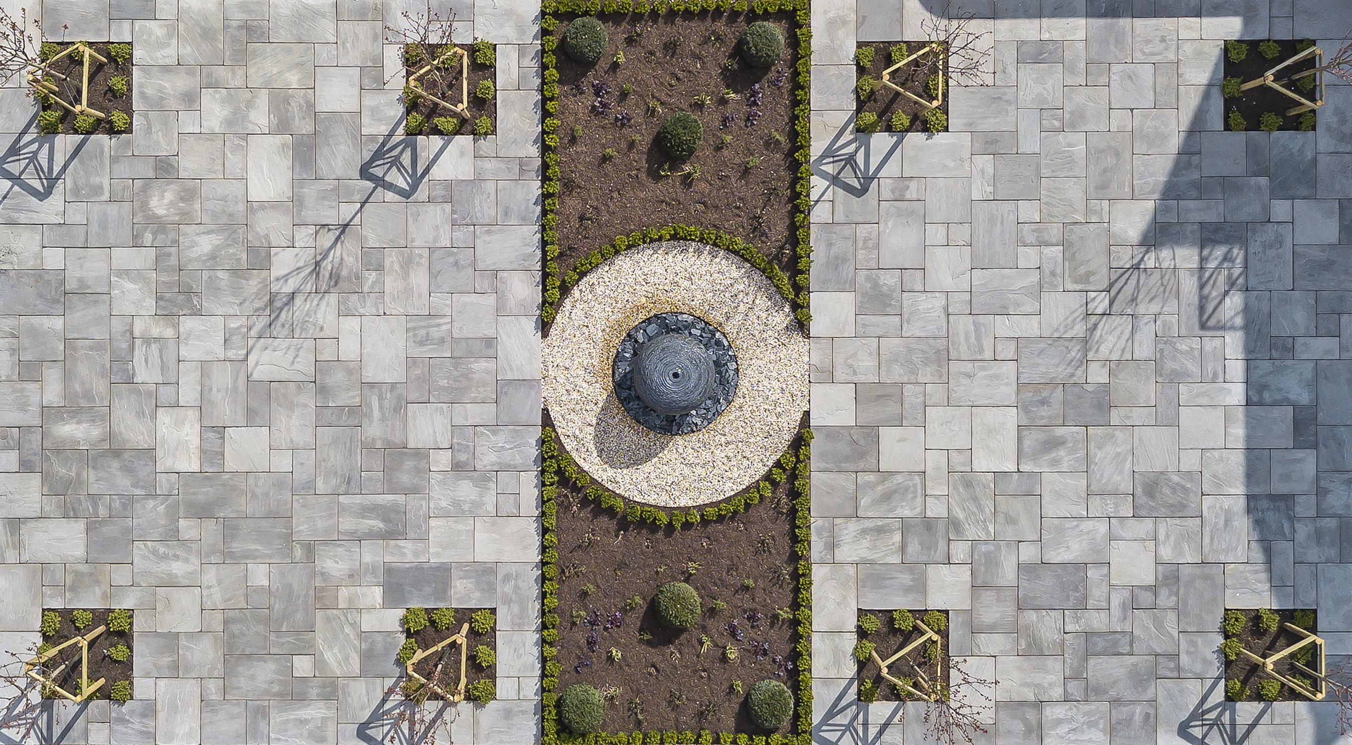 1m Grey Watersphere™ set as a focal point in this large walled, paved garden. The drone photo showing the excellent symmetry in this garden.